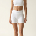 SECOND. organic cotton bike shorts in white, front view on a bone studio background